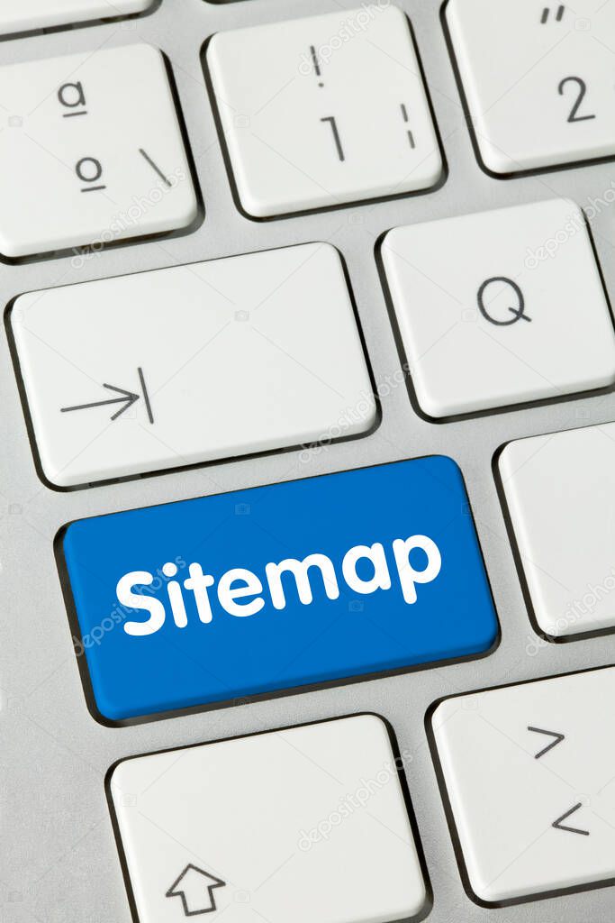 Sitemap Written on Blue Key of Metallic Keyboard. Finger pressing key.