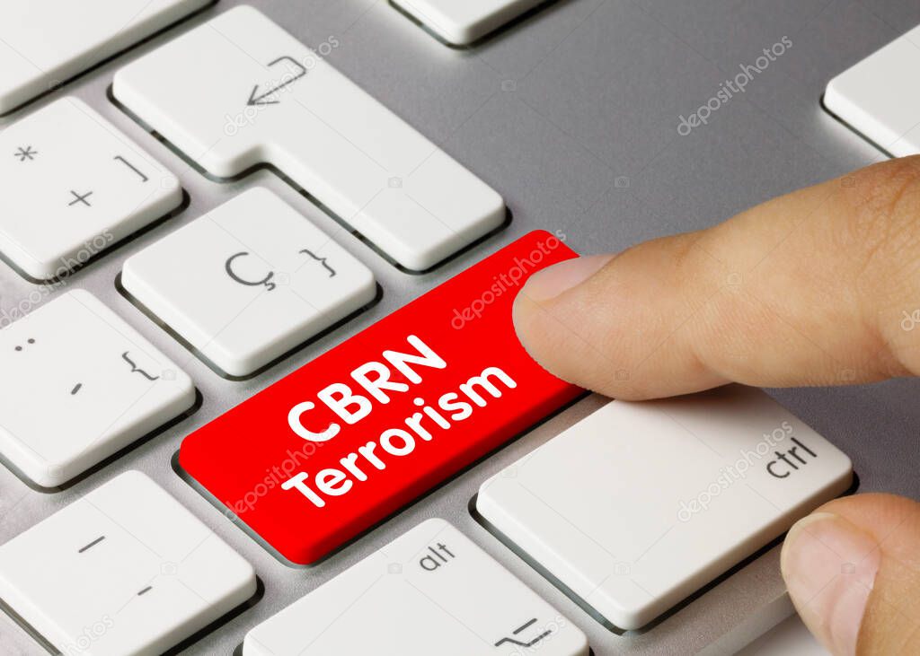 CBRN Terrorism Written on Red Key of Metallic Keyboard. Finger pressing key.