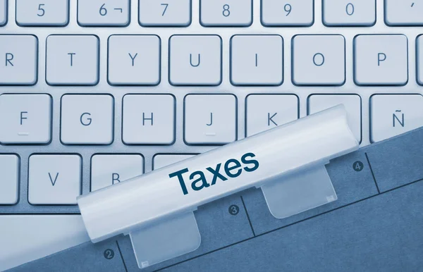 Taxes Written Blue Key Metallic Keyboard Finger Pressing Key — Stock Photo, Image