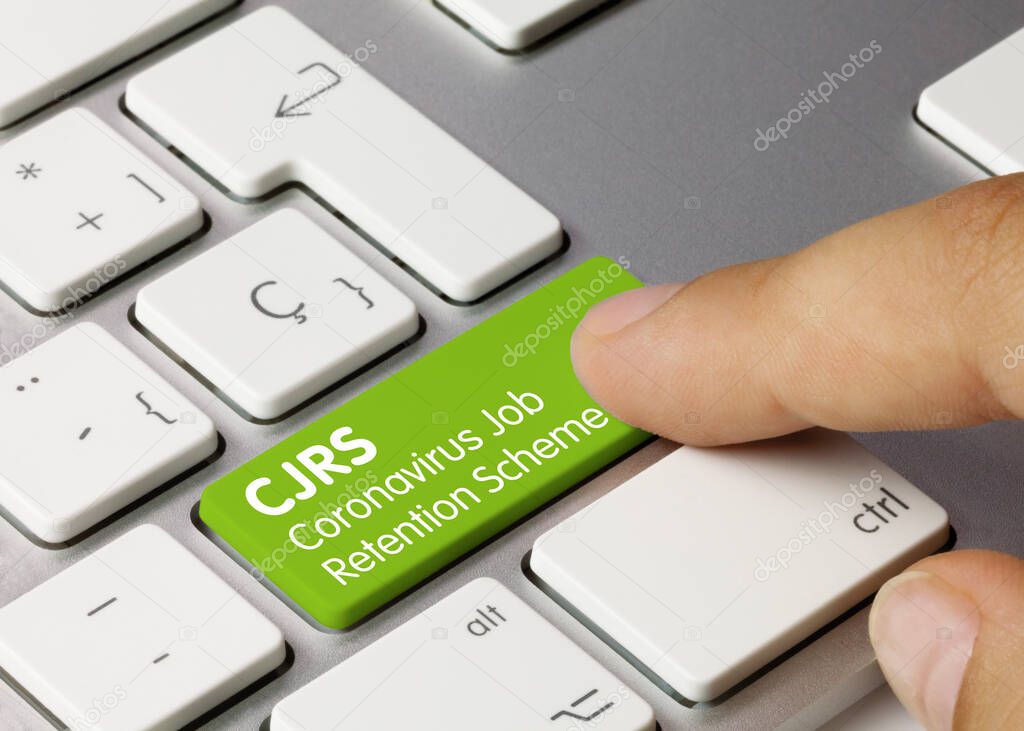 CJRS Coronavirus Job Retention Scheme Written on Green Key of Metallic Keyboard. Finger pressing key.