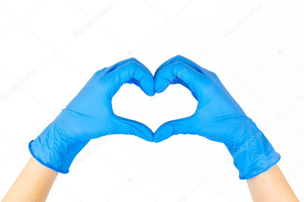 Stock photo of a woman's hands with blue gloves forming a heart with her fingers isolated on white