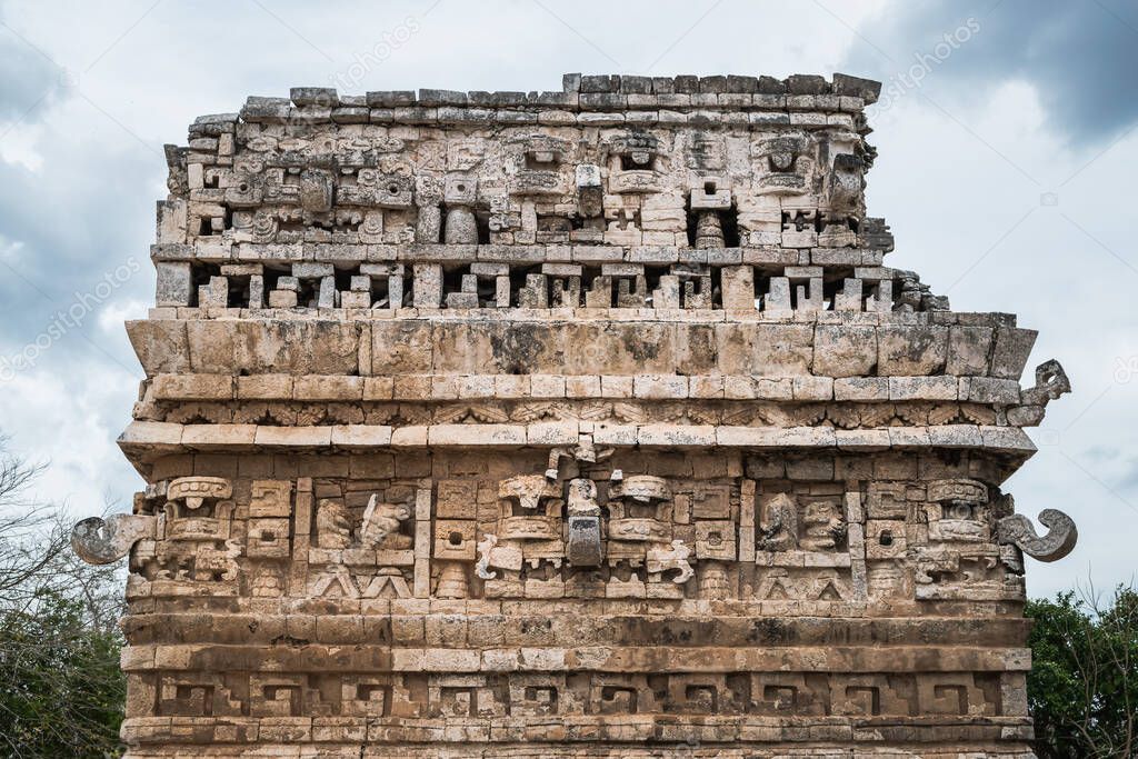 Pre-columbian carvings on the walls of one of the building at the Chichen-Itza Mayan site, Mexico.