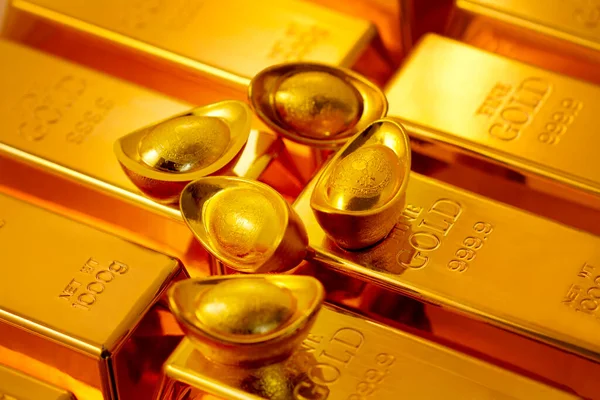 Gold bars and gold bullions on background, close up