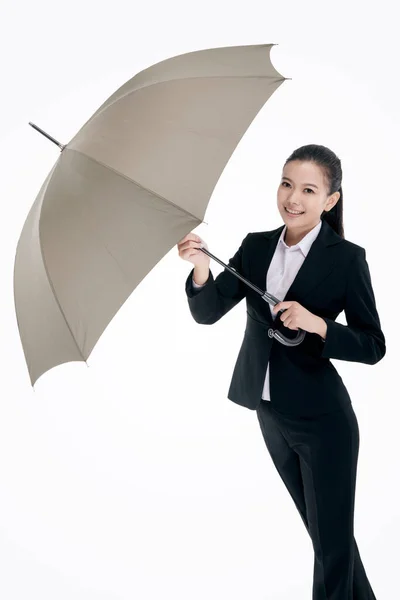 Oriental Fashion Business Woman Holding Umbrella Stock Photo