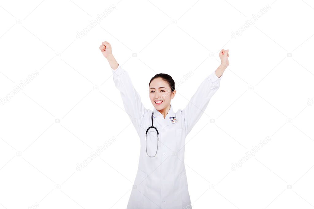 The young female doctor with arms upraised