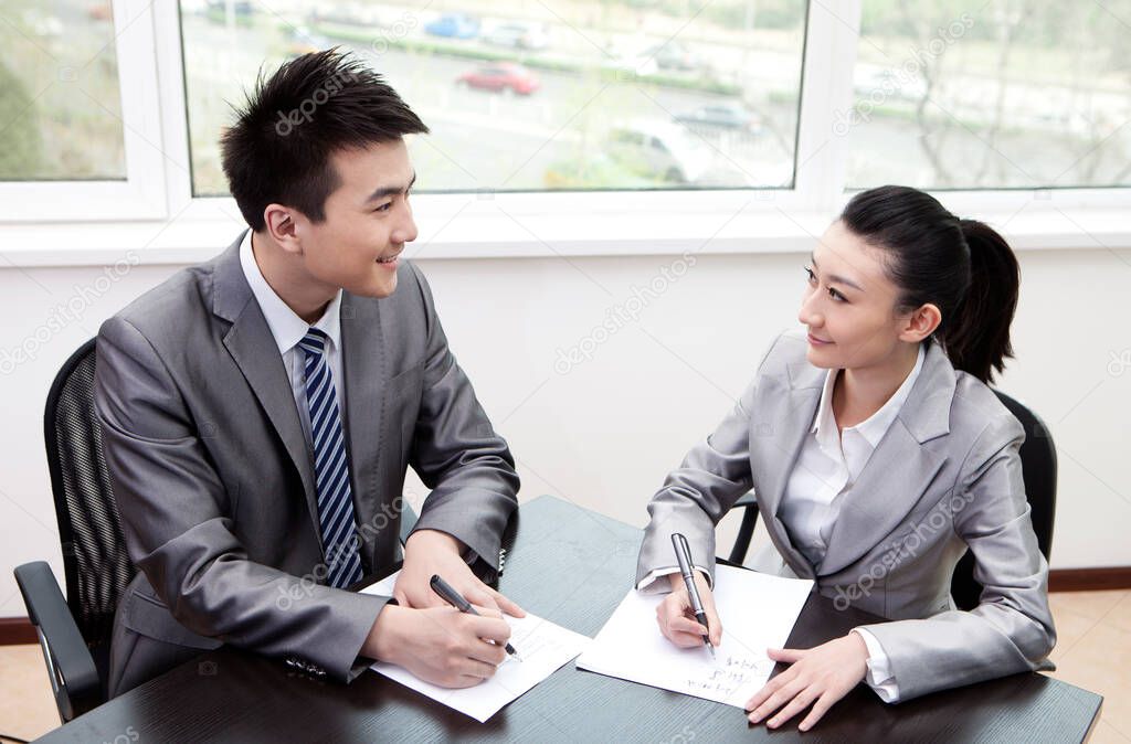 Businessman and businesswoman in a business meeting,portrait