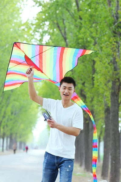 Young Man Flying Kite — Stock Photo, Image