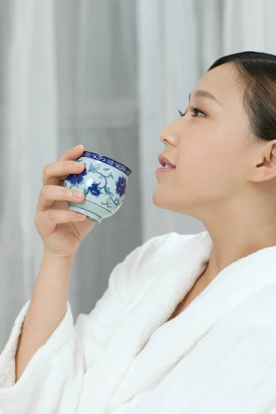 Young Woman Wearing Bathrobe Drinking Tea — Stock Photo, Image