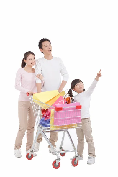 Portrait Daughter Parents Pushing Shopping Cart Looking Away — Stock Photo, Image