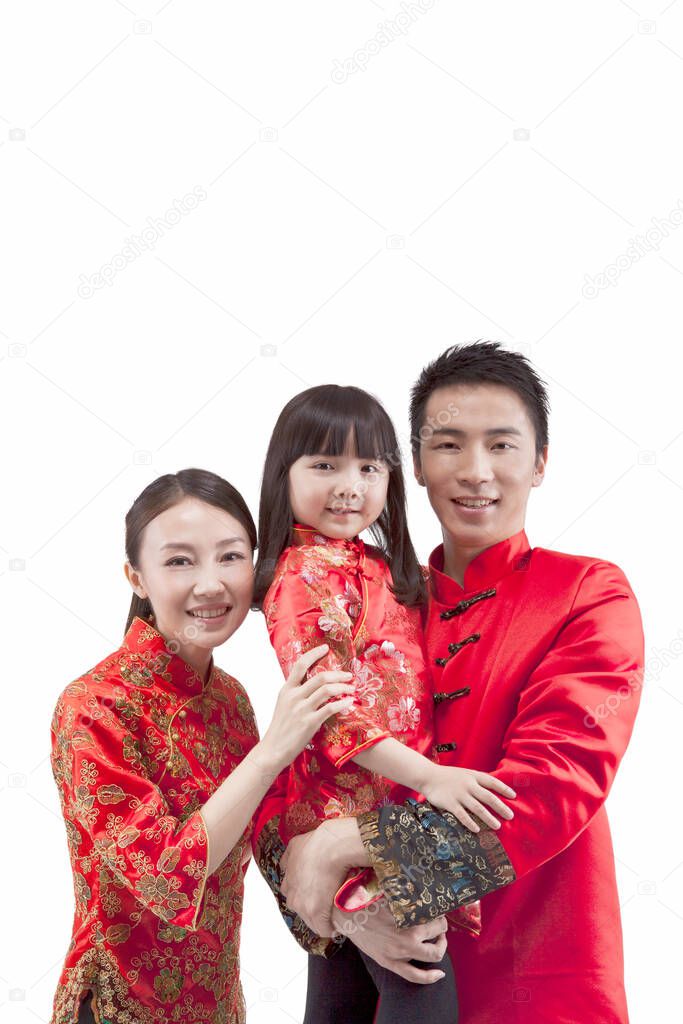 	Portrait of daughter with parents in Tang suits 	