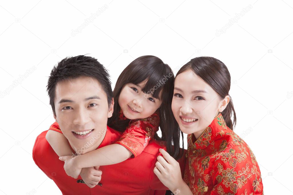 	Portrait of daughter with parents in Tang suits,close-up	
