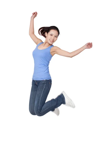 Young Woman Jumping Air Arms Outstretched White Background Portrait Stock Photo