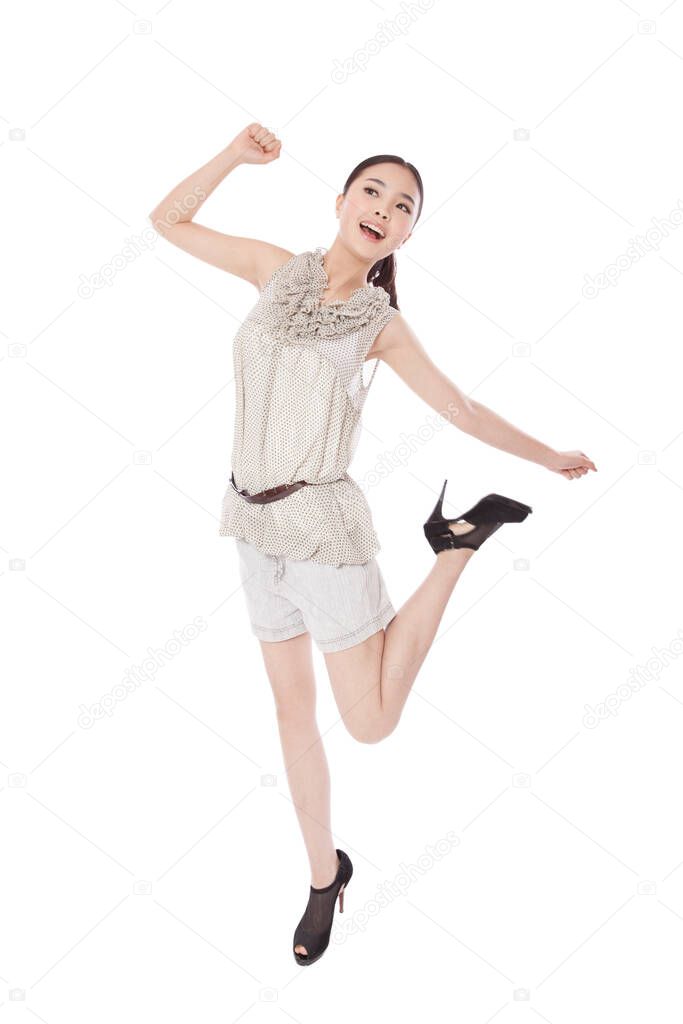 	Young woman jumping,smiling	