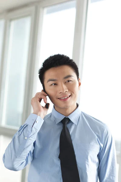 Portrait Young Businessman Talking Cell Phone Office — Stock Photo, Image