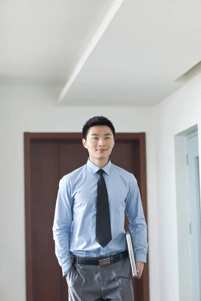 Portrait Young Businessman Holding Laptop Corridor — Stock Photo, Image