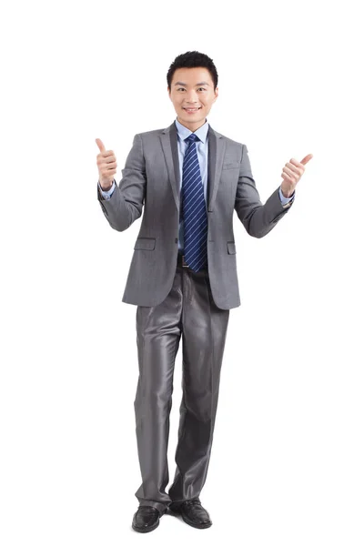 白地に親指を立てて立つ若い実業家の肖像 — ストック写真