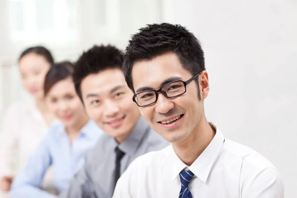 Executives Sitting Conference Table Focus Man Foreground — стоковое фото