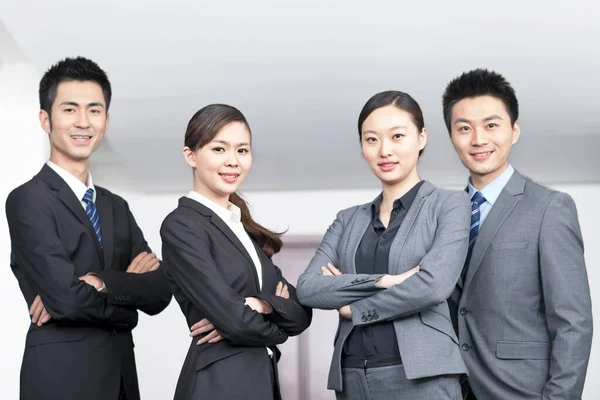 Four Young Office Workers Hands Crossed Indoors Portrait — Stock Photo, Image