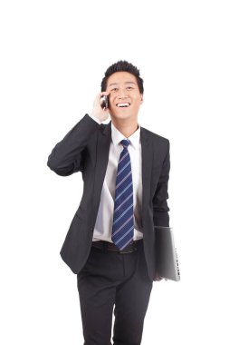 İşadamı Dizüstü bilgisayar ve Phono 'yu elinde tutuyor