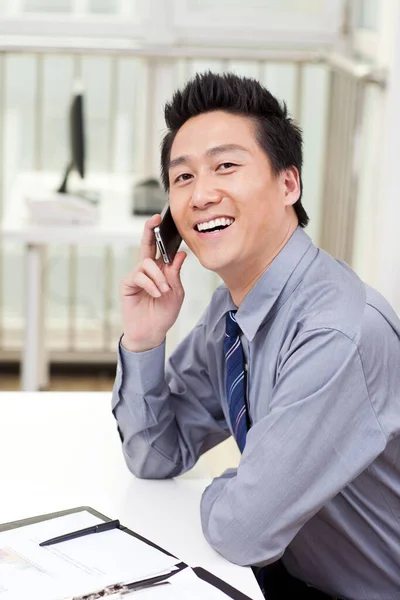 Businessman Using Laptop Phono Office — Stock Photo, Image