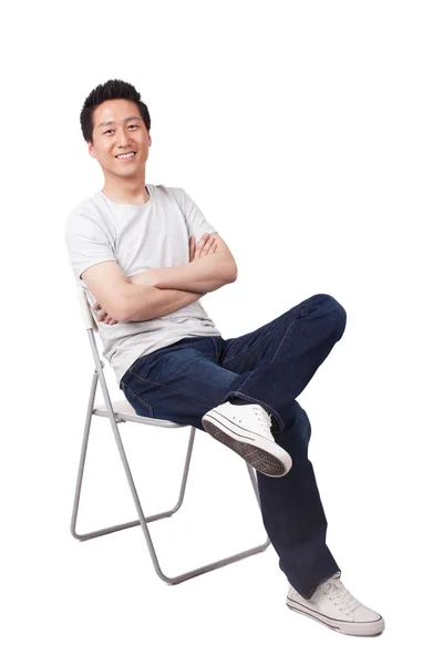 Pomyślny Młodzieniec Siedzący Pozycji Siedzącej — Zdjęcie stockowe