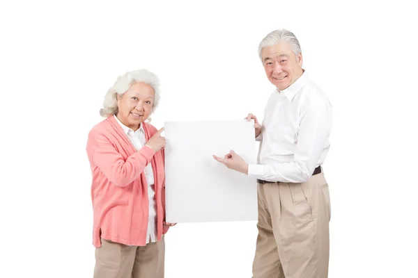 Pasangan Senior Memegang Papan Putih — Stok Foto