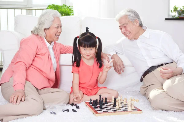 Senior Couple Granddaughter Playing Game — Stock Photo, Image