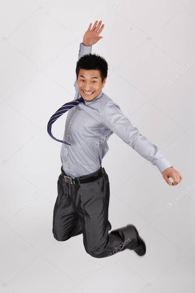 A jumping young business man