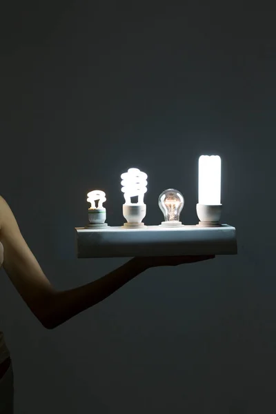 Young woman and a light bulb