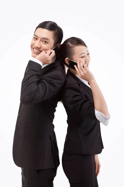 若いビジネスの男性と女性のバックに戻る電話 — ストック写真