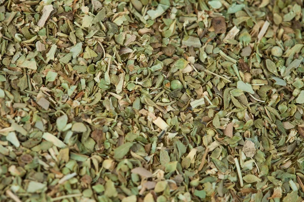 Dry Oregano herb on texture background