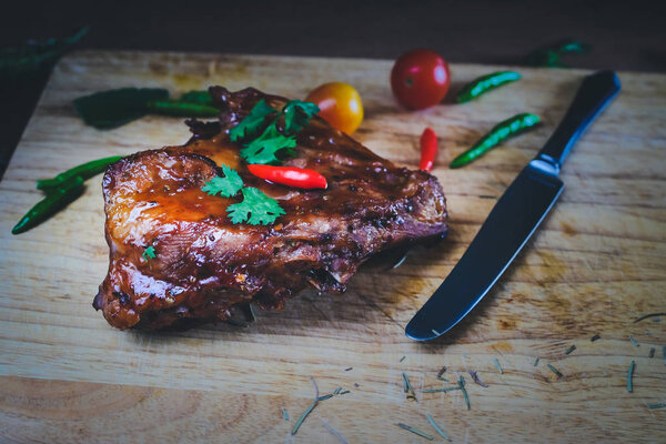 Grilled meat pork ribs on wood table.
