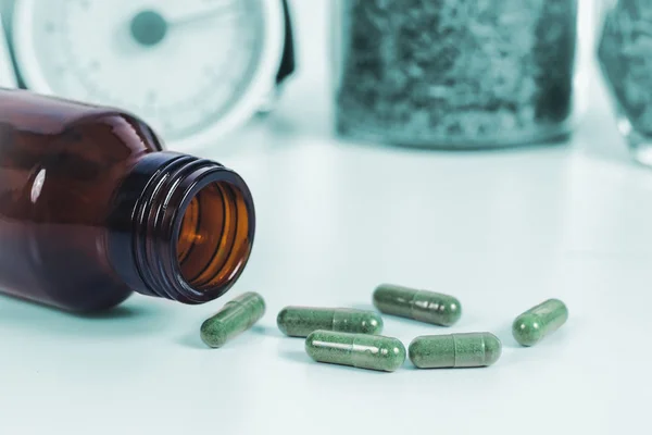 Drug Capsule Spilled Out Bottle Laboratory Table — Stock Photo, Image