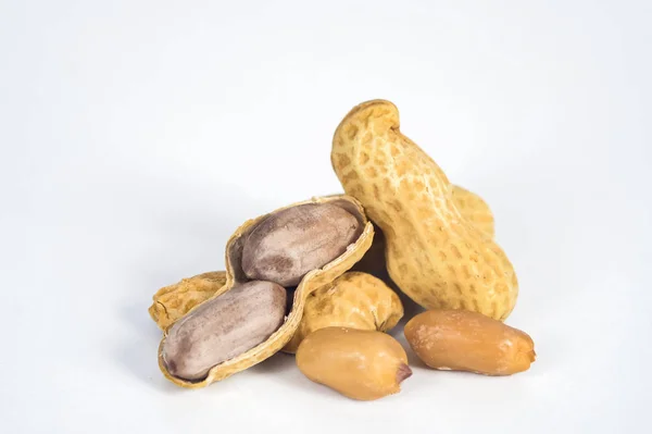 Peanuts in shells on white background. — Stock Photo, Image