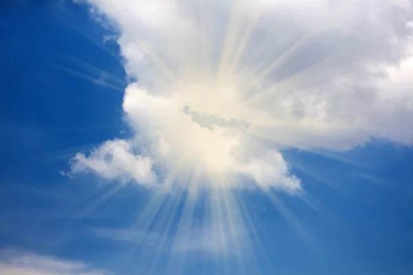 Blue sky with a cloud and light ray — Stock Photo, Image