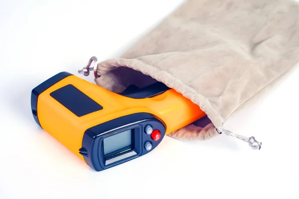 Yellow Infrared thermometer gun used to measure temperature  on