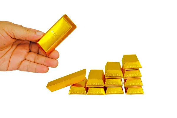 Heap of gold bars in hand with gold stack isolated on a white ba