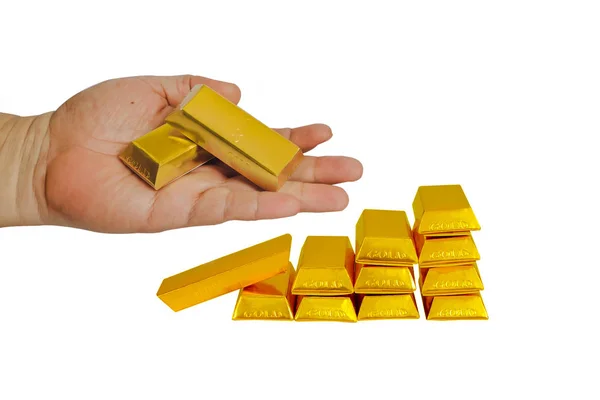 Heap of gold bars in hand with gold stack isolated on a white ba