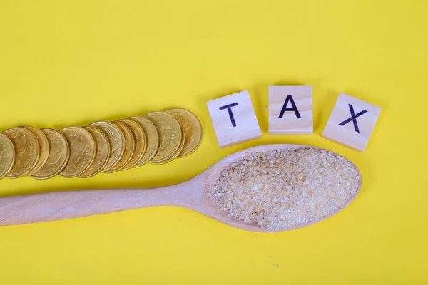 Die Zuckersteuer ist eine Steuer oder ein Zuschlag, die den Verbrauch verringern soll. — Stockfoto
