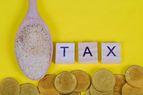 Die Zuckersteuer ist eine Steuer oder ein Zuschlag, die den Verbrauch verringern soll. — Stockfoto