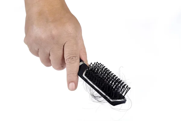 Peigne avec perte de cheveux à la main sur fond blanc, beauté de la santé c — Photo