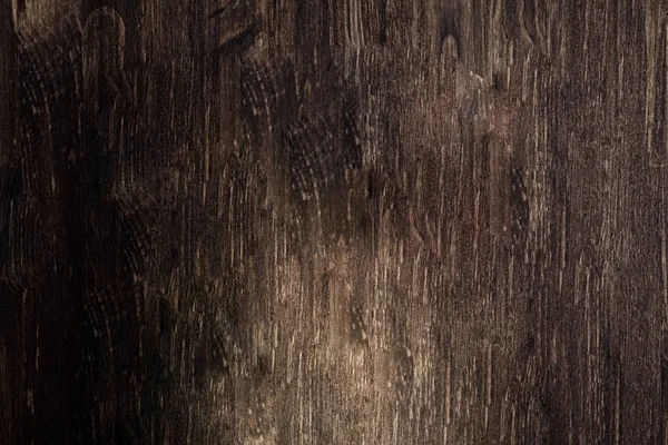 Dark brown wooden table background with light below. Empty rustic old grunge decorative wood surface with strict wooden texture — Stock Photo, Image