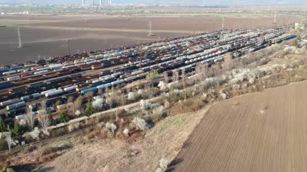 Aerial Drone Shot Showing Many Colored Freight Train Cars Oil — Stock Video