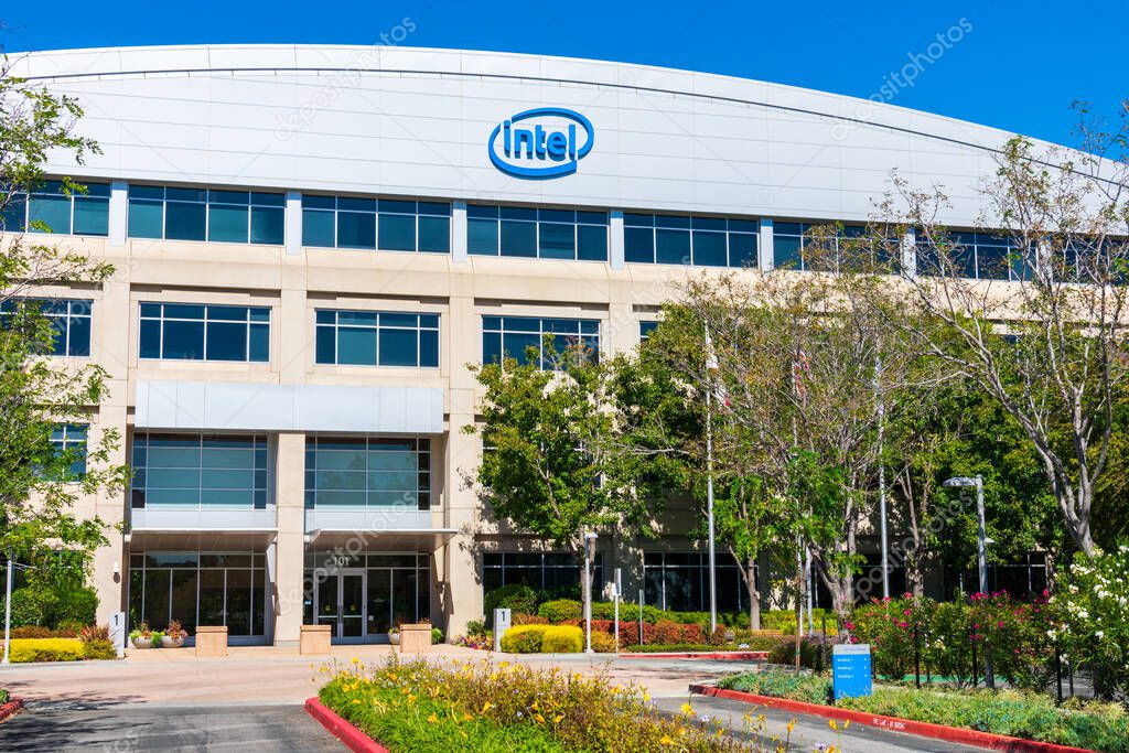 Intel Corporation campus building entrance surrounded by lush green vegetation. Intel Corporation is an American multinational corporation and technology company - San Jose, CA, USA - October 2019
