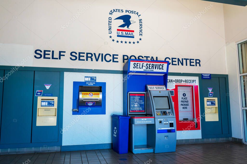 USPS self service postal center with self service kiosk and collection boxes located inside United States Post office - Cupertino, California, USA - 2018