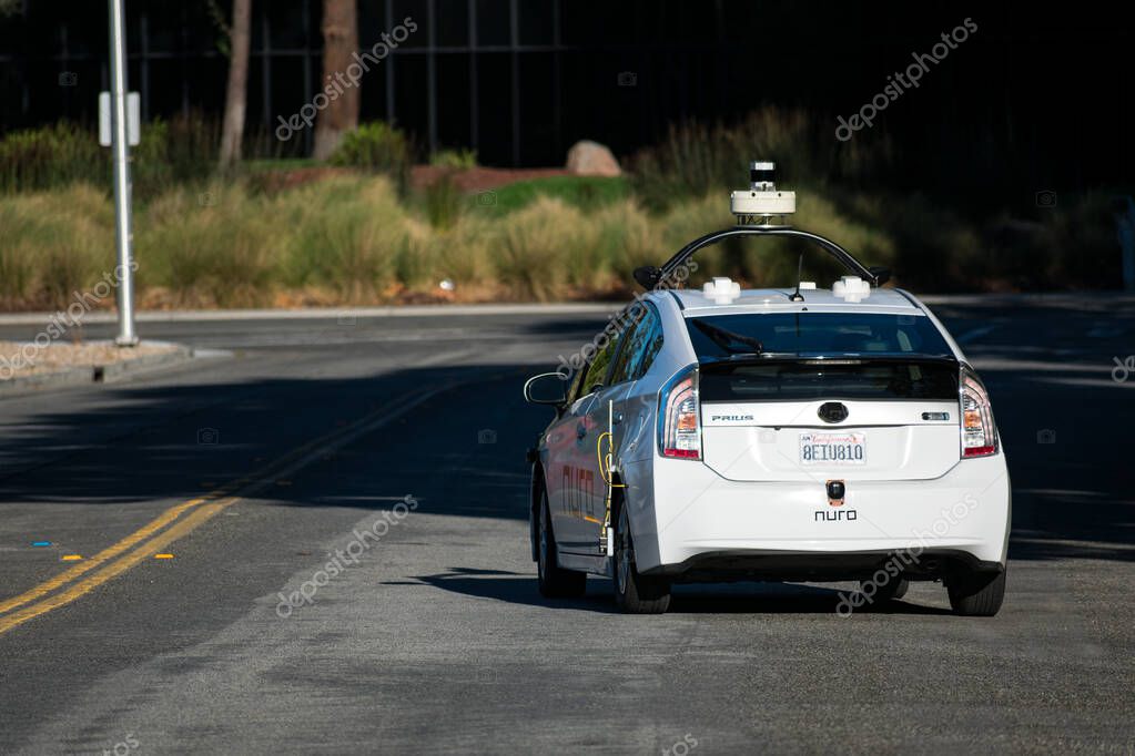 Nuro autonomous self-driving vehicle driving on a street in Silicon Valley - Santa Clara, California, USA - 2020