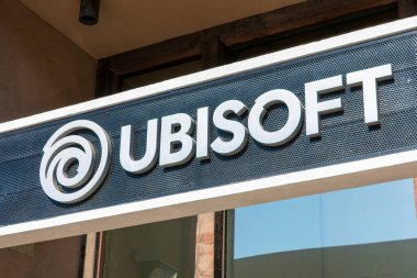 Ubisoft logo and sign above the entrance to Ubisoft Entertainment SA office.Ubisoft is a French video game company headquartered in Montreuil - San Francisco, California, USA - 2020 clipart