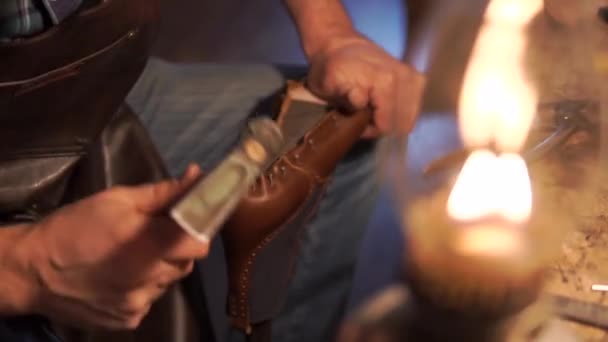 Shoemaker makes and repairs shoes for men — Stock Video