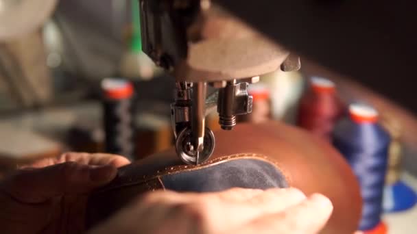 Sewing machine and red leather with a seam close-up. sewing process — Stock Video