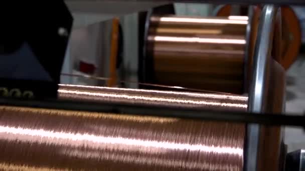 Production of copper wire, the copper cable is reeled off the reel — Stock Video